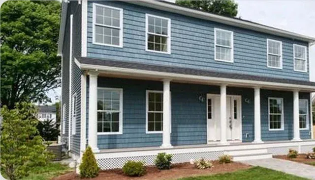 Blue-shingled coastal style modular home