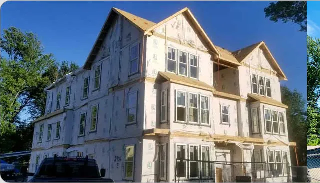Three-story apartment building framed and set in Dorchester